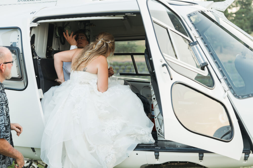 Spokane wedding venue with bride getting into a helicopter