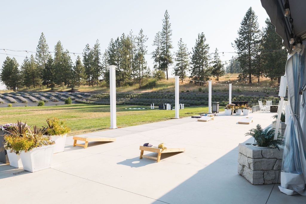 Cocktail hour games with mountain views at a Coeur D'alene garden wedding venue