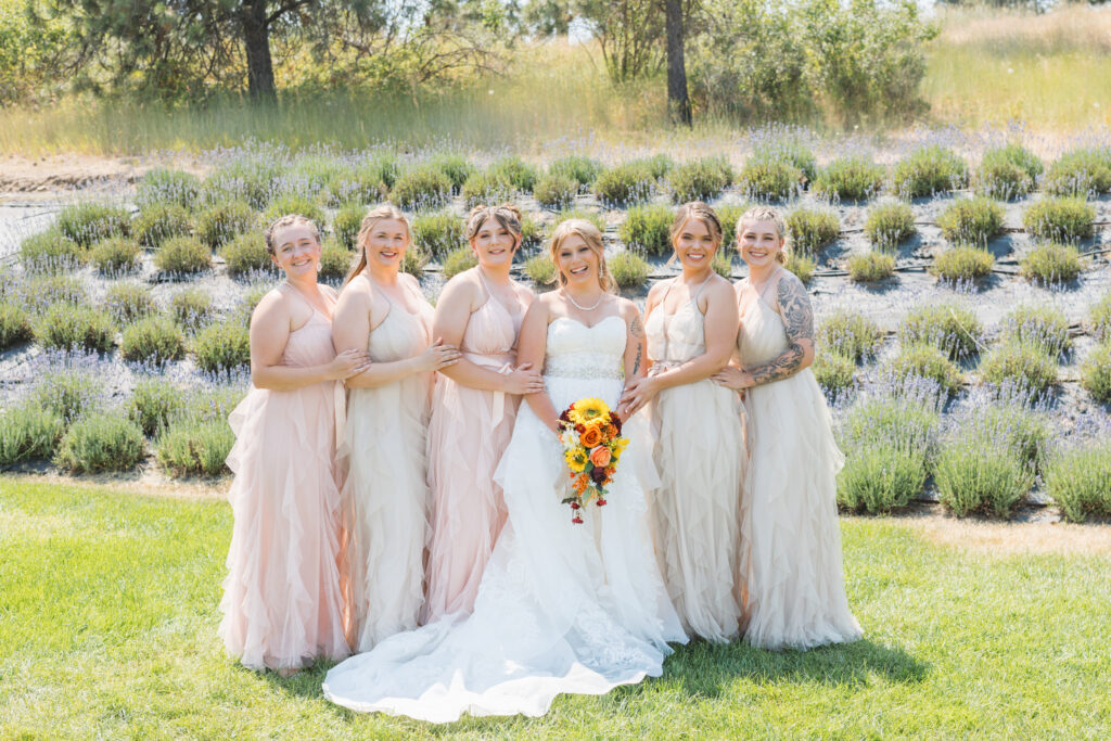 What to Wear to a Spokane Wedding by Season, bridesmaids wearing spring dresses at a garden wedding