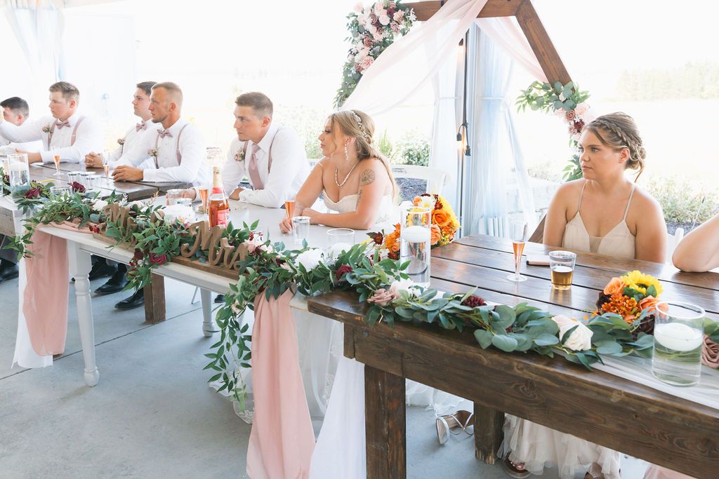 Wedding guests wearing garden party wedding attire at an elegant Spokane wedding venue