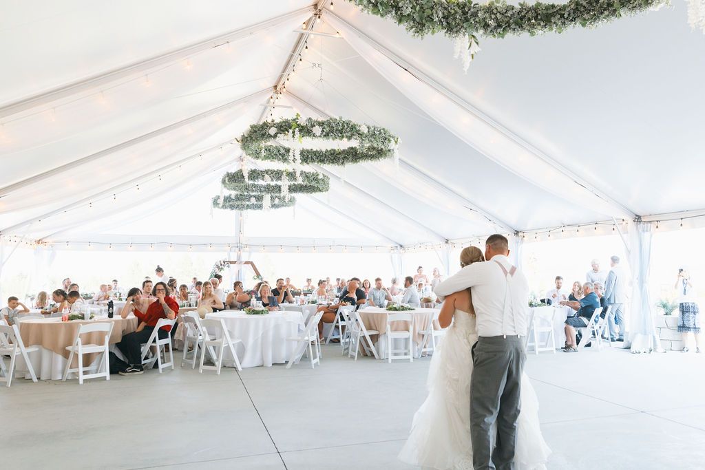Wedding guests wearing garden party wedding attire at an elegant Spokane wedding venue