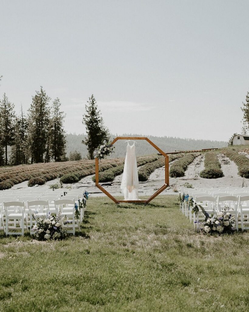 Outdoor garden wedding ceremony at Lavender Manor near Spokane accommodating large wedding guest counts