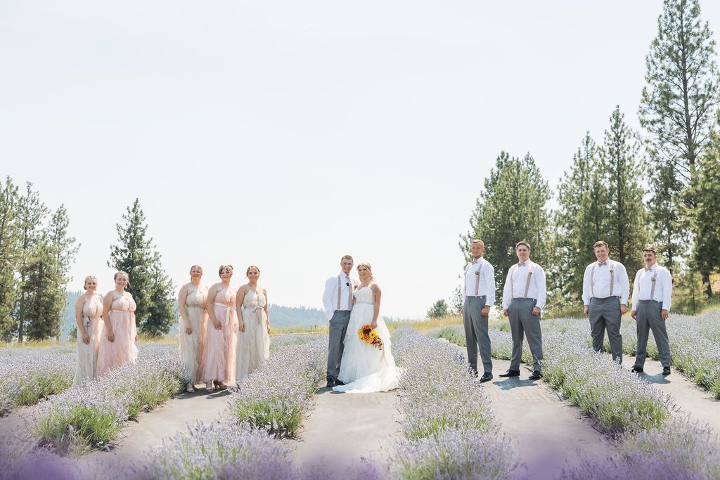 Spokane bride, groom and wedding party pose for fall photos at a garden wedding venue with mountain views and lavender fields